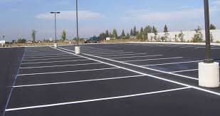 Sealed and line-marked car park with light poles at Jupiters Casino