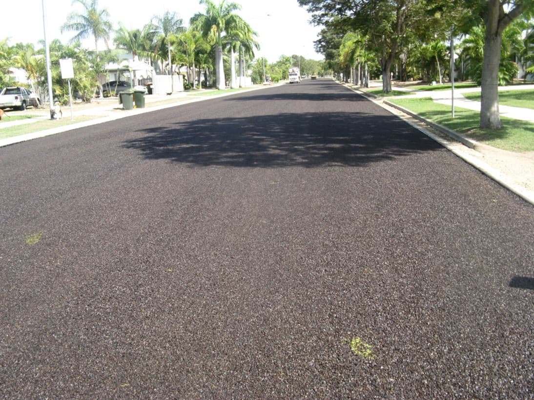 New asphalt overlay on Pioneer Drive, with street trees along both verges